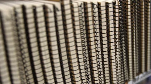 Stack of notebook in an office supply store. Refocusing between writing pad. Stock Footage 204092607