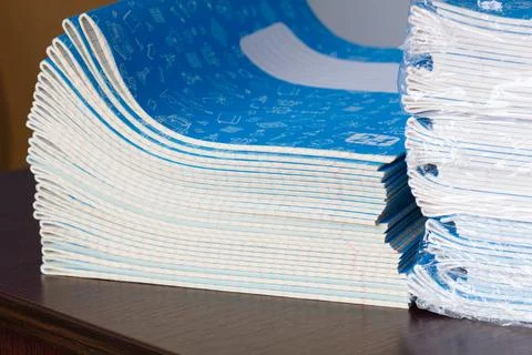 Stack of Notebooks. Back to school. A pack of blue school notebooks on the table Stock Photos