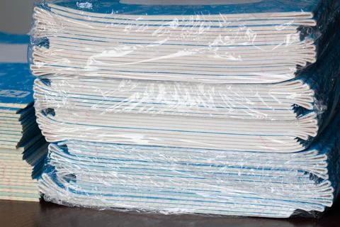 Stack of Notebooks. Back to school. A pack of blue school notebooks on the table Stock Photos