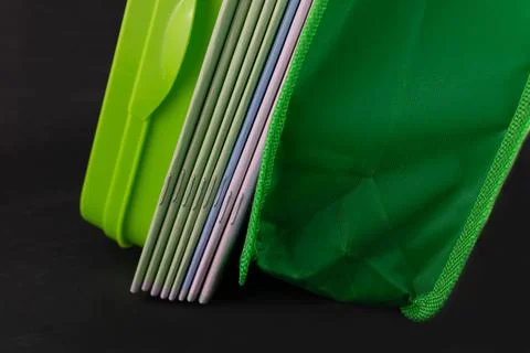 A stack of notebooks a pencil case and a briefcase Stock Photos