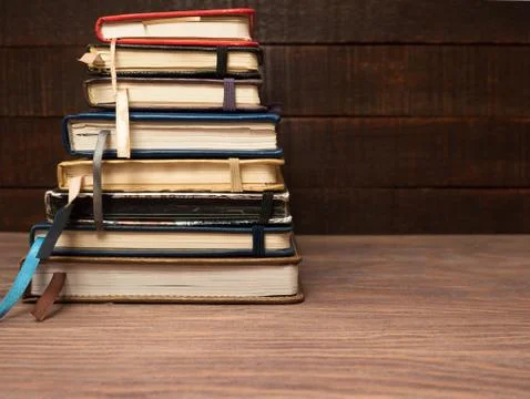 A stack of notebooks on a wooden table Stock Photos