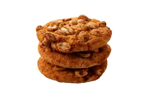 A stack of nuts and caramel cookies isolated on white. Stock Photos