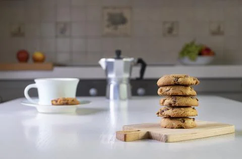 Stack of oatmeal cookies with chunks of chocolate lies on table Stock Photos