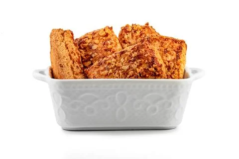 Stack oatmeal cookies cinnamon with nuts isolated on white table Foto stock