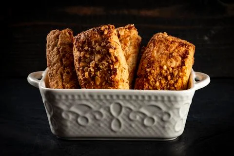 Stack oatmeal cookies cinnamon with nuts isolated on dark table Foto stock