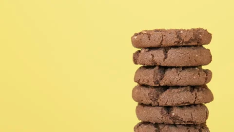 Stack of oatmeal cookies with cocoa, chocolate and hazelnuts Stock Footage 104653476