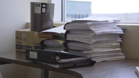 Stack of office files, records and binders on a desk Stock-Footage 85178514