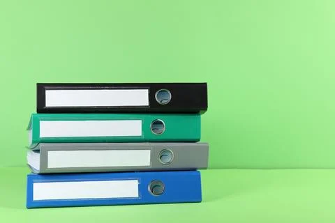 Stack of office folders on light green background, space for text 스톡 사진
