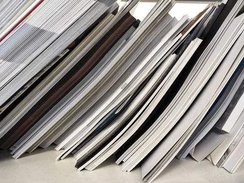 A stack of office papers and magazines. waste paper Stock Photos
