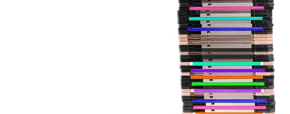 Stack of old 1.44 inch floppy disks used to save computer data Foto stock