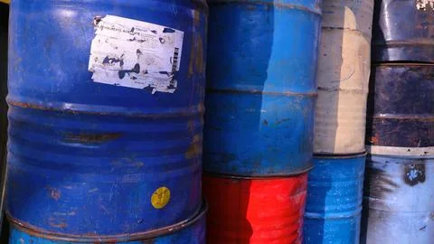A stack of old aged rusty barrels for vintage background, copy space Stock Photos