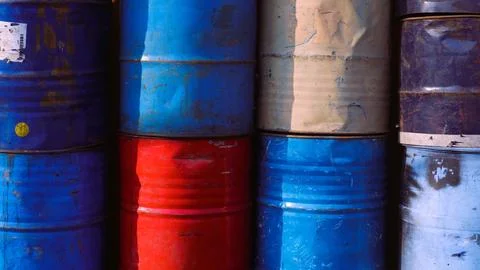 A stack of old aged rusty barrels for vintage background, copy space Stock Photos