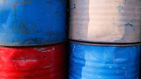 A stack of old aged rusty barrels for vintage background, copy space Stock Photos