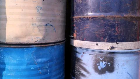 A stack of old aged rusty barrels for vintage background, copy space Foto stock