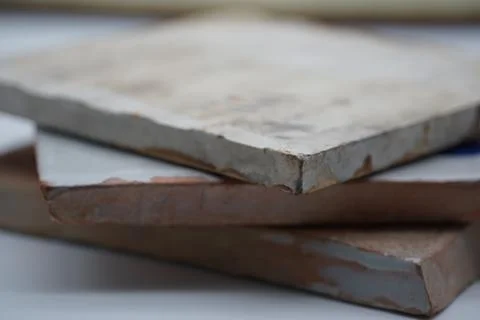 Stack of old and rusty unedged metal boards Stock Photos