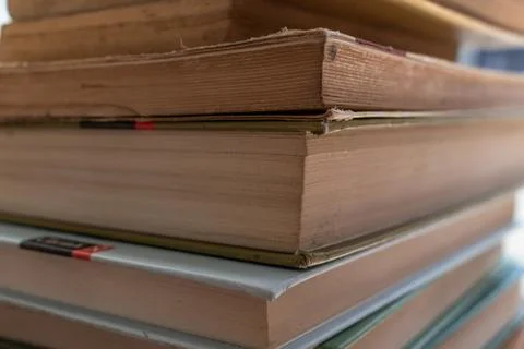Stack of old and yellowed books Stock Photos