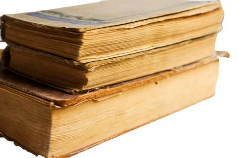 Stack of old antique big books isolated on white background Stock Photos
