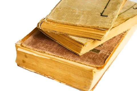 Stack of old antique big books isolated on white background Stock Photos