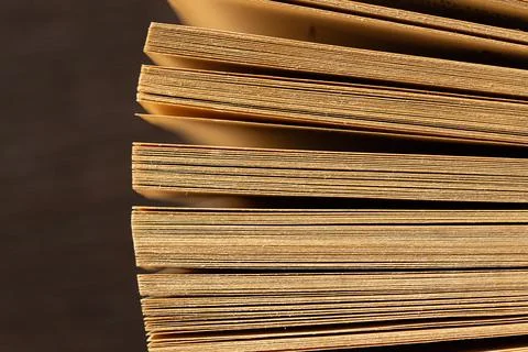Stack of old book pages showing aged texture and knowledge 스톡 사진