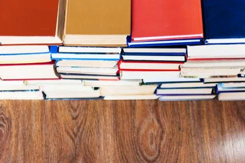 Stack of old book on wooden table, education concept background, many books p Stock Photos