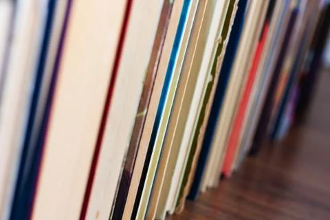 Stack of old book on wooden table, education concept background, many books p Stock Photos