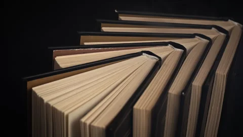 Stack of Old Books Among Magical Smoke or Fog on Black Background Stock Footage 263908195