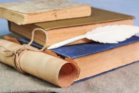 Stack of old books and manuscript on the table Stock Photos