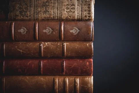 Stack of old books on black background Stock Photos