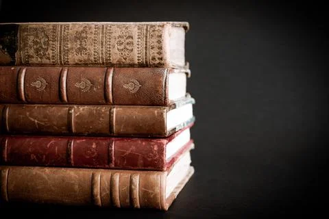 Stack of old books on black background Stock Photos