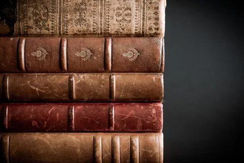 Stack of old books on black background Stock-Fotos