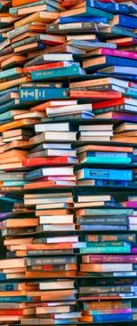 Stack of old books in a book store, side view of many books. Educational co.. Stock Photos