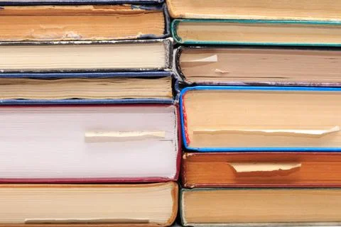 A stack of old books with bookmarks in different directions on different p... 写真素材