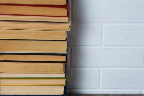 A stack of old books. Bookstore, library, bookshelf. Vintage, retro, antique. Stock Photos