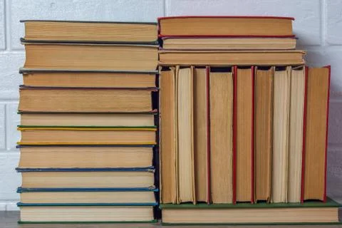 A stack of old books. Bookstore, library, bookshelf. Vintage, retro, antique. Stock Photos