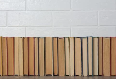 A stack of old books. Bookstore, library, bookshelf. Vintage, retro, antique. Stock Photos
