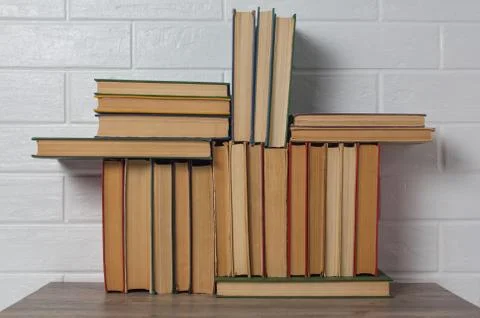 A stack of old books. Bookstore, library, bookshelf. Vintage, retro, antique. Photos