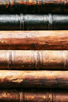 Stack of old books close up. Books in a row or stacked. Vintage or retro book Stock Photos