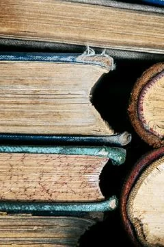 Stack of old books close up. Books in a row or stacked. Vintage or retro book Stock Photos