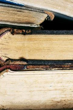 Stack of old books close up. Books in a row or stacked. Vintage or retro book Stock Photos