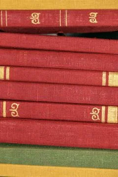 Stack of old books close up. Books in a row or stacked. Vintage or retro book Stock Photos
