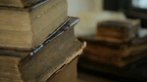 Stack of old books in library Video stock 75426148