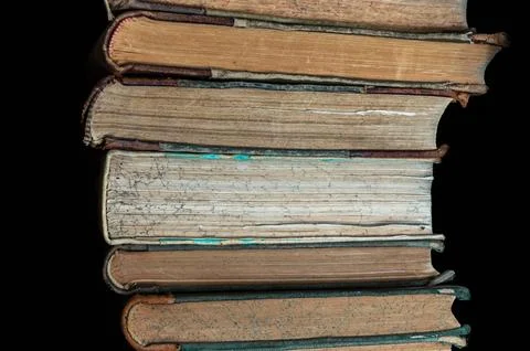 Stack of old books on a library shelf Stock Photos