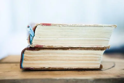 Stack of old books on light background Stock Photos