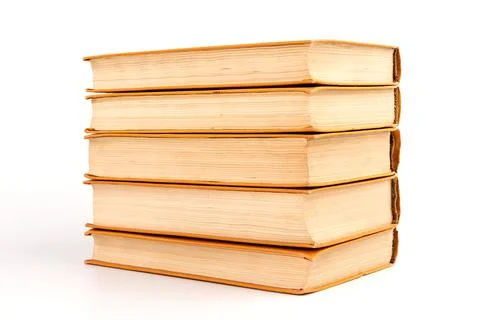 Stack of old books on light background. Book pile. Stock Photos
