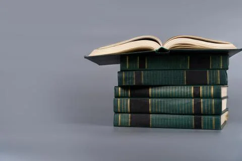 A stack of old books on a plain background Foto stock