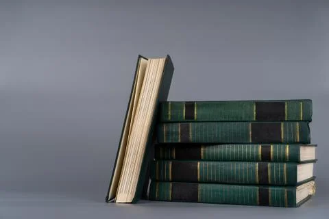 A stack of old books on a plain background Stock Photos