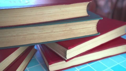 A stack of old books on a table. Stock Footage 294248189