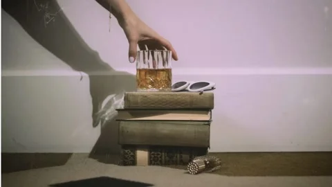 Stack of Old Books with Whiskey Glass and Sunglasses vintage Stock Footage 339163084