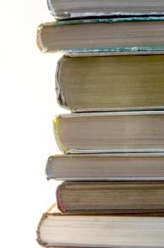 Stack of old books on white background Stock Photos