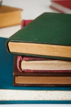 Stack of old books on white Stock Photos
